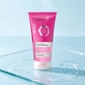 Eveline Facemed Hyaluronic Face Wash Gel on a wet light blue glass surface