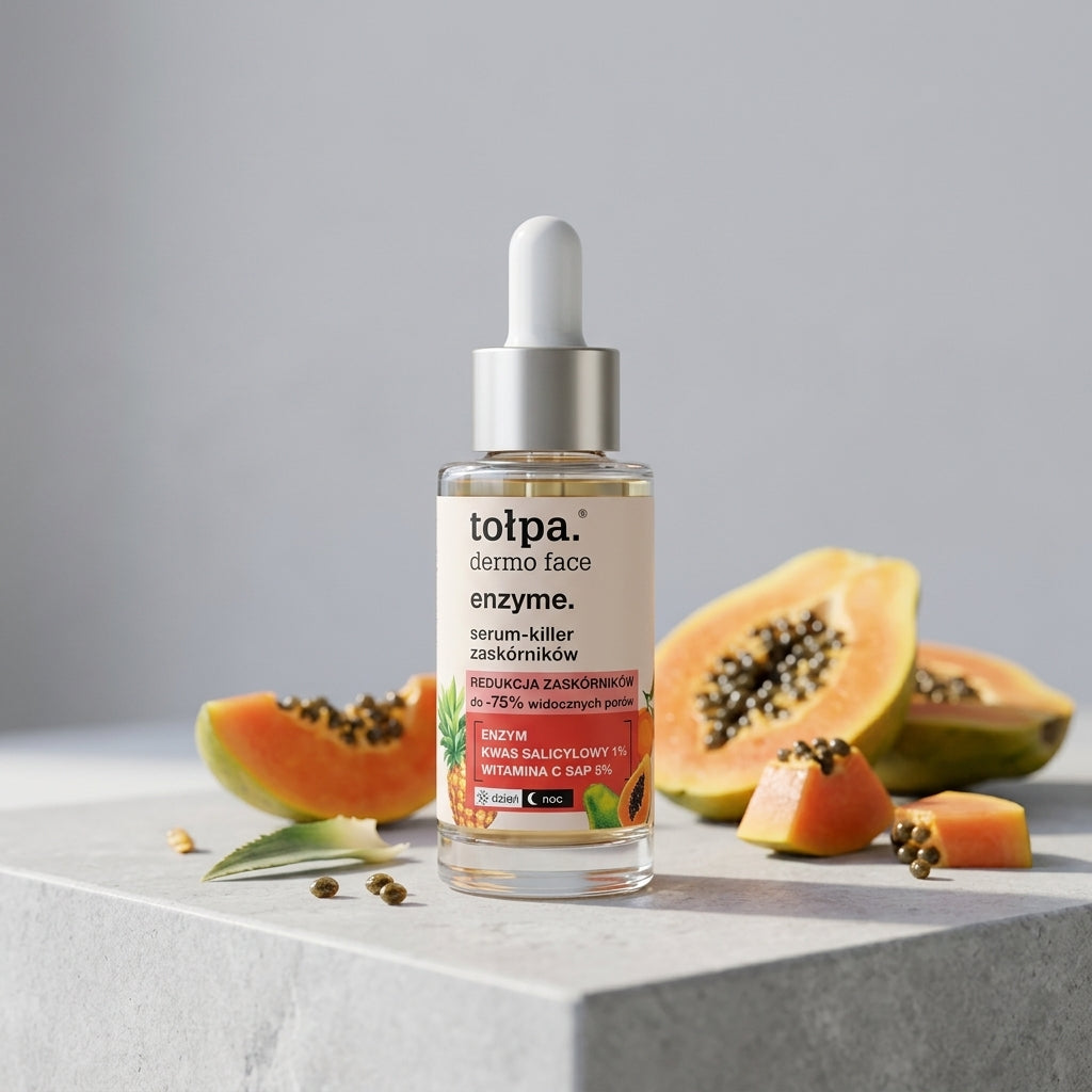 Tolpa Dermo Face Enzyme Serum lifestyle display on a gray stone surface with papaya slices